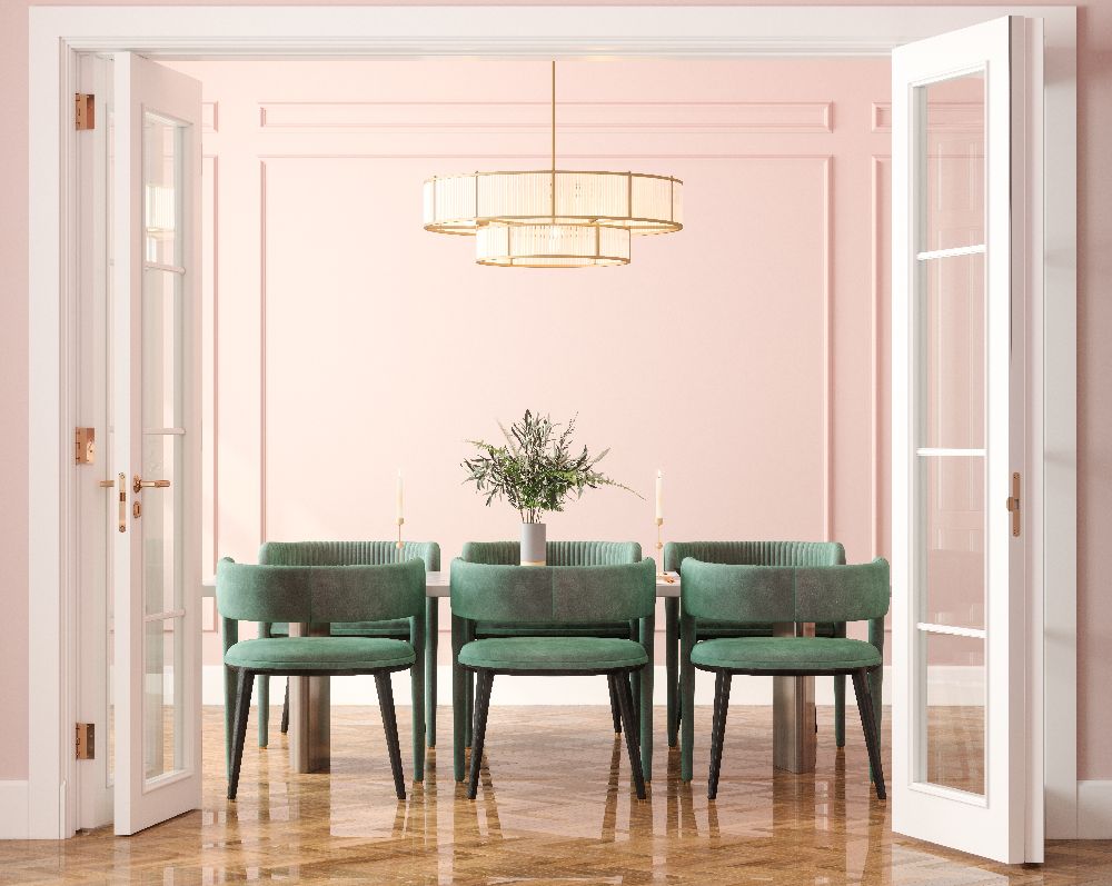 A living room anchored by a soft olive green sofa, treated as a foundational neutral